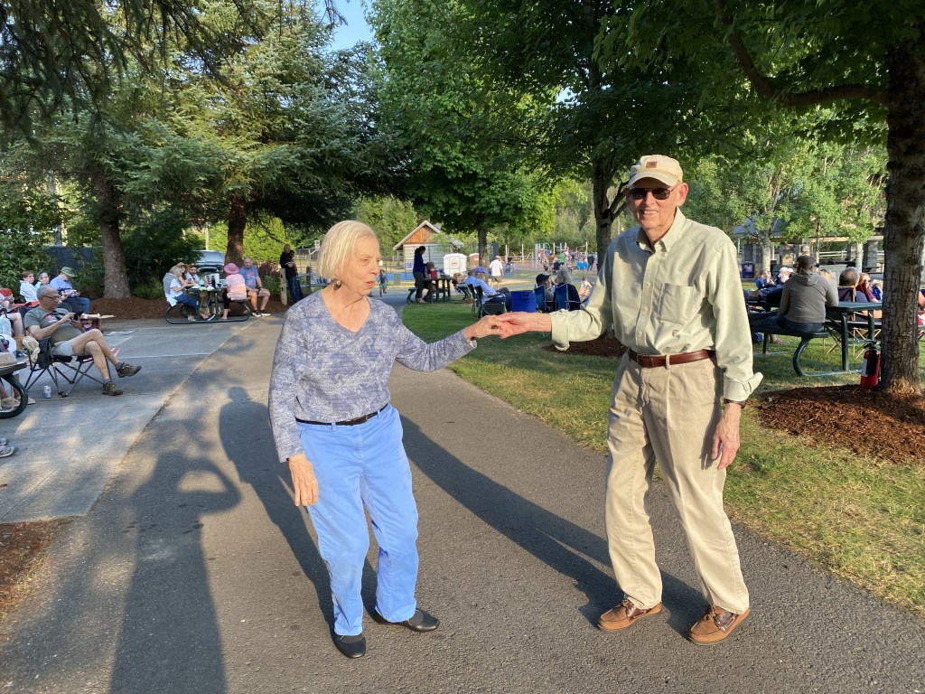 Couple dancing at Cottage Lake Music in the Park July 23, 2026