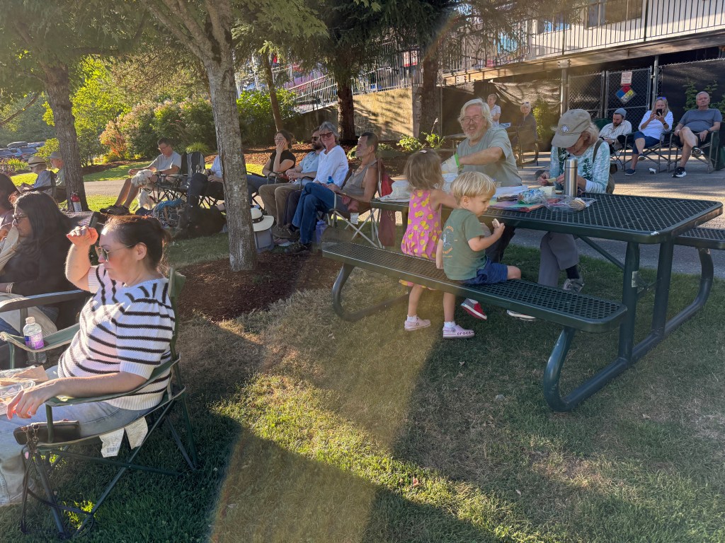 Snack time at July 30, 2026 Music in the Park at Cottage Lake listening to Stillwater Hill